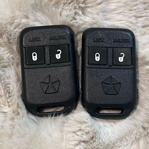 2 OEM Chrysler/Dodge keyless entry remote fobs with the FCC ID GOH-M24